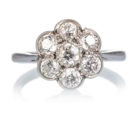 DIAMOND CLUSTER RING, the diamonds totalling approximately 0.80 carats, in eighteen carat white gold, size KQty: 2.7gWorn con