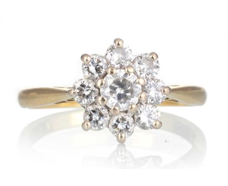 DIAMOND CLUSTER RING, set with round brilliant cut diamonds totalling approximately 0.80 carats, in eighteen carat gold, size