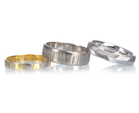 THREE EIGHTEEN CARAT GOLD WEDDING BANDS, one bicolour, the others in white goldQty: 11.3g grossSizes L-R = M 1/2, M 1/2, K 1/