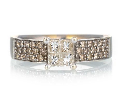DIAMOND TILE RING, set with a central quad of princess cut diamonds, the shoulders pave set with cognac diamonds, marked 750,
