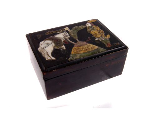 A Japanese black lacquered papier mache box,  with tethered horse and warrior motif composed of applied jade, mother of pearl