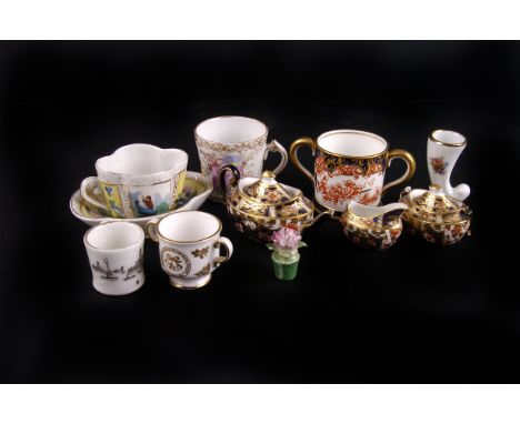 A collection of porcelain miniatures,  including a Royal Crown Derby three piece  tea service, a German porcelain coffee cup,