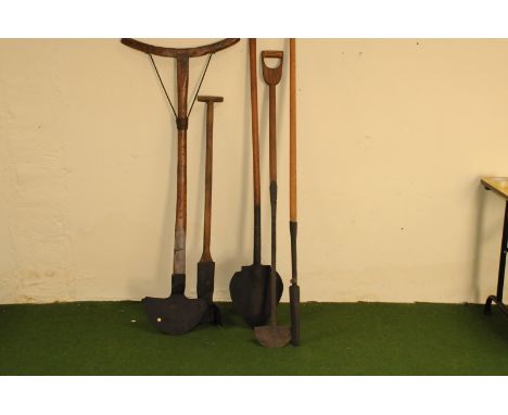 A group of five antique and vintage long handled cutting tools, including a good example with curved handled and cast iron bl