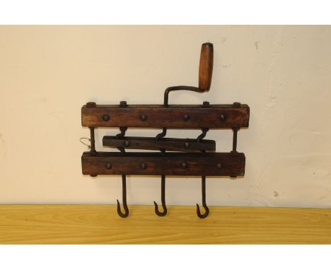 An antique rope making tool, having handle and three hooks 