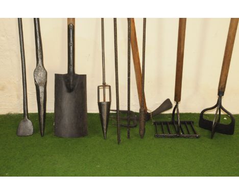 A group of various vintage farm tools, including three cast iron prodding and sampling tools, an interesting four way cutter,