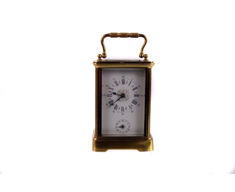 A French brass carriage clock with alarm,  in original leather case 