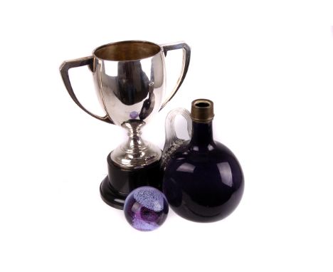 Three silver neck decanters, a 19th century purple glass bottle decanter, a Caithness paper weight, and a silver plated troph