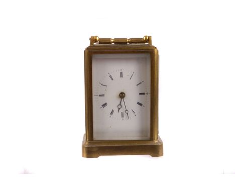 An early 20th century carriage clock, the enamel dial with roman numerals, and marked A.d. to the back plate 12cm H, presente
