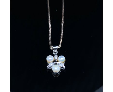 A DIAMOND AND PEARL PENDANT. THREE PEARLS AND THREE DIAMONDS EVENLY SET, SUSPENDED ON AN S LINK CHAIN. BOTH PIECES UNMARKED, 