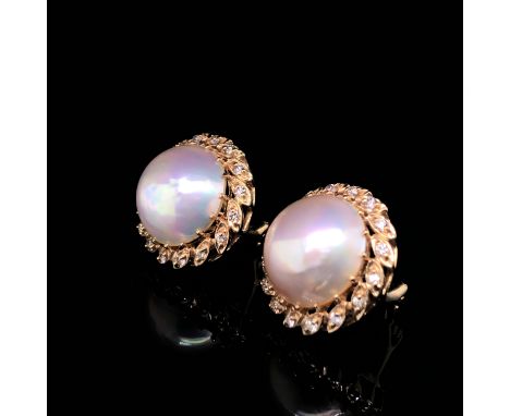 A PAIR OF MABE PEARL AND DIAMOND EARRINGS WITH LEVER BACK SAFETY PIERCED EAR FITTINGS. EACH MABE PEARL SURROUNDED BY A WREATH