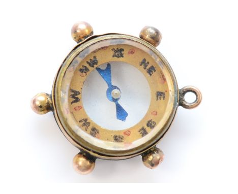A 9ct gold compass charm, 13mm diameter, 2.4g 