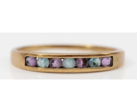 A 9ct gold amethyst and blue gemstone half eternity ring, channel set, R, 1.5g 