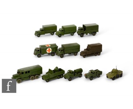 A collection of Dinky military vehicles including 621 3-Ton Army Wagon, Austin covered wagon, 623 Army Wagon, 689 Medium Arti