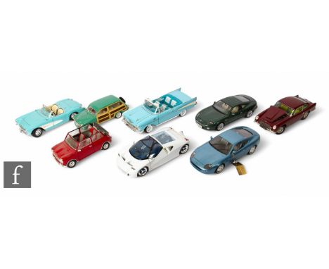 A collection of large scale diecast models by Sun Star, Maisto, Burago, Corgi and others, including models of Aston Martin DB