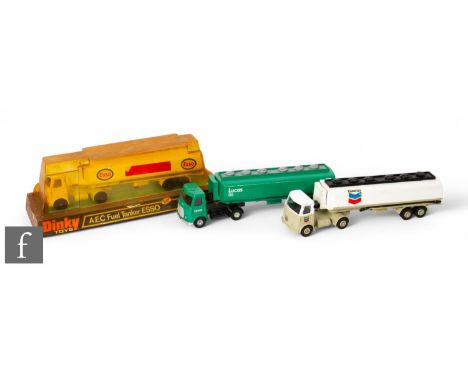 A group of Dinky diecasts, 945 AEC Fuel Tanker ESSO, boxed, with two other 945 AEC Fuel Tankers, one Lucas Oil, the other rep