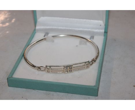 A Hallmarked front opening Sterling silver bangle 