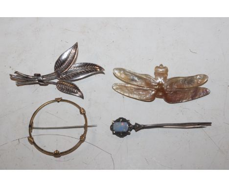 A white metal opal set brooch in the form of a dragonfly; a yellow metal brooch and a white metal brooch in the form of leave