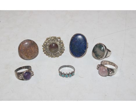 Two 925 silver rings set with coloured stones; a Sterling silver and turquoise set ring; and four white metal rings set with 