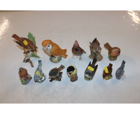 A collection of Beswick, Goebel, and Royal Worcester bird ornaments 