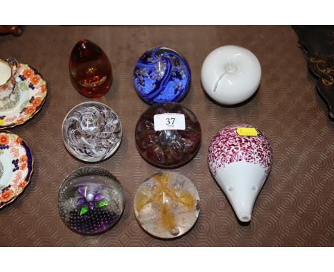 Four Caithness paperweights and four Wedgwood examples 