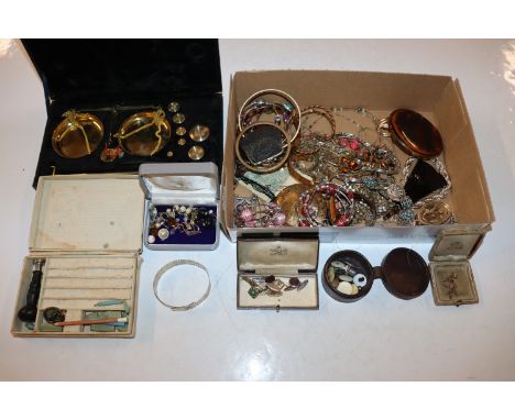 A box of jewellery to include rolled gold and other bangles, cuff-links, compacts, and a cased set of brass scales 