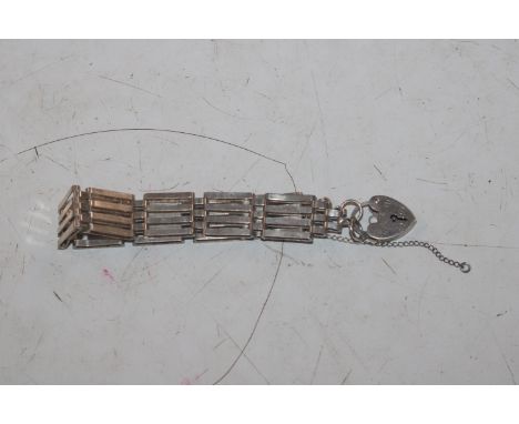 A silver gate link bracelet with padlock clasp 