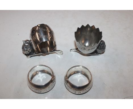 A pair of silver napkin rings, Birmingham 1921; a silver plated Rogers Bros. napkin ring and similar egg cup
