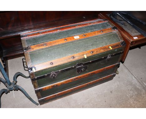 A green canvas and battened dome topped trunk