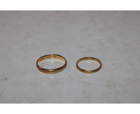 A 22ct gold wedding band, ring size V 5.5gms; and another 22ct gold wedding band, ring size O, 2.5gms 