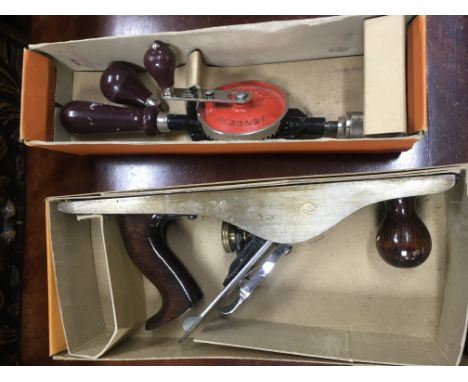 A large collection of tools including Stanley planes and manual drills.