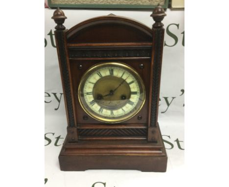 A mahogany cased eight day mantle clock. Shipping category D. NO RESERVE