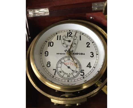 A Russian marine ships chronometer desk clock fitted in a mahogany case ,