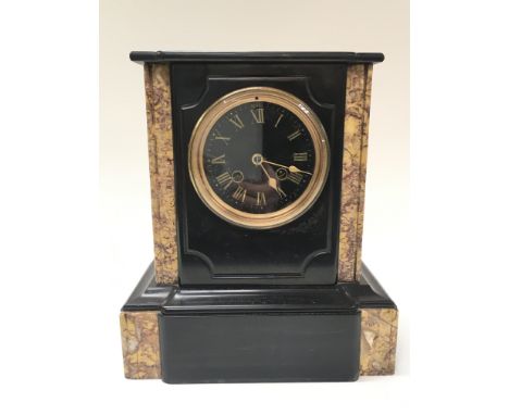 A black slate and marble mantle clock with key, 28cm tall 25cm wide. This lot cannot be posted. NO RESERVE