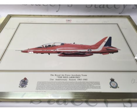 A collection of signed and framed red arrow prints in various sizes.