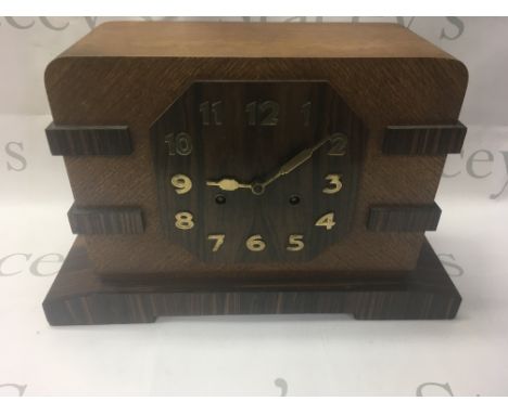 A Rosewood and Oak Bauhaus style mantle clock.