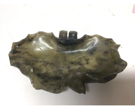 A Chinese spinach jade dish of naturalist form a shaped lotus leaf possible early 20th century. 13x9cm NO RESERVE