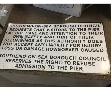 Four metal signs including a Southend pier warning sign, a London & Provincial enamel sign, a dog control area sign and a rep