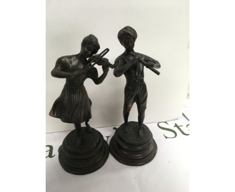 A pair of bronzed figures playing musical instruments. 26 cm. NO RESERVE