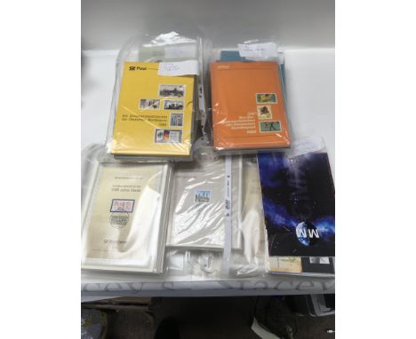 A box containing 1991-1995 German stamps, also including year books 1992-1995 86-89 and 80-83. And first day cover 1992,93,94