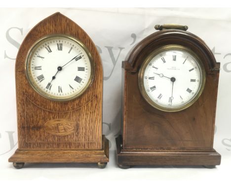 Two Elizabethan mantle clocks with inlaid design , both with keys. Jays clock seen working. 23 and 21cm tall. This lot cannot