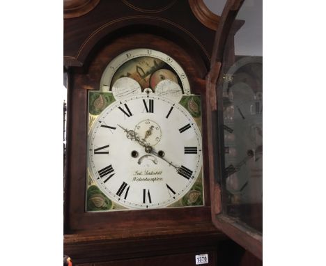 A oak long case clock the arched panted dial with moon roller Roman numerals and second dial . NO RESERVE
