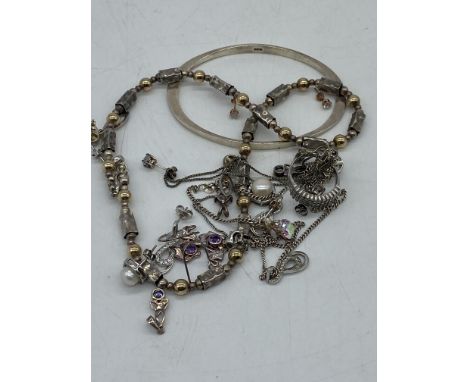 A mixed lot of silver, ring, bangle, earrings, pendants, weight is 66.5 grams approx,