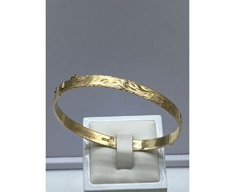 A 9ct yellow gold solid vintage bangle, 7 inches in diameter x 6mm wide, 11.2 grams approx weight