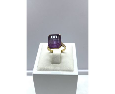 A 9ct yellow gold amethyst ring, 5.1 grams in weight approx, size J, stone is 14mm x 10mm