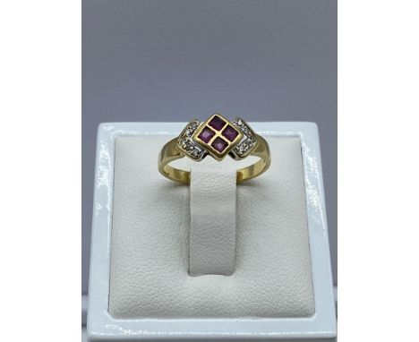 An 18ct yellow gold diamond &amp; ruby dress ring, 2.8 grams in weight approx, size L
