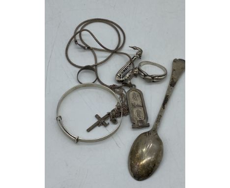 A mixed lot of silver, 33 grams in weight approx, teaspoon, pendant, kids bangle and rings