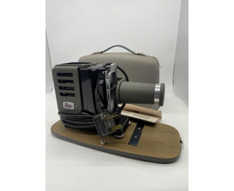 A vintage Prado 150 projector in original box