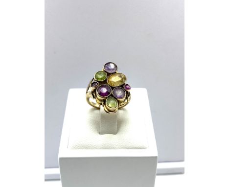 A 9ct yellow gold dress ring, amethyst, peridot &amp; citrine stones, 5.8 grams in weight approx, size J