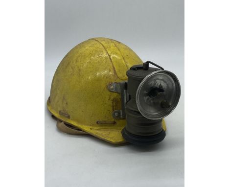 A vintage minors lamp helmet