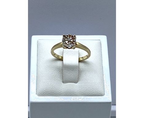 A 10ct yellow gold diamond cluster solitaire ring, 2.2 grams in weight approx, size N, diamond shoulders